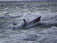 Fisherman in the surf of Lake Malawi